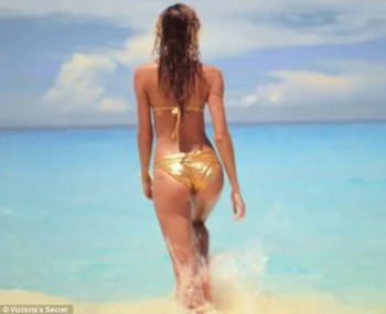 Sexy Candice Swanepoel in golden bikini